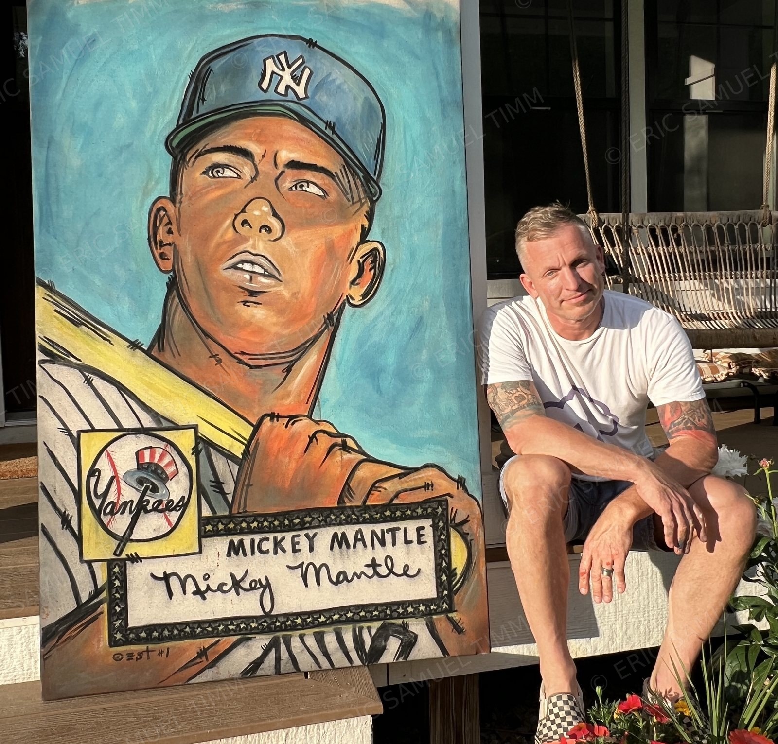 Eric Samuel Timm sitting beside his Mickey Mantle painting